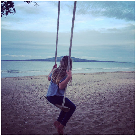 girl on a swing, takapuna, rangitoto